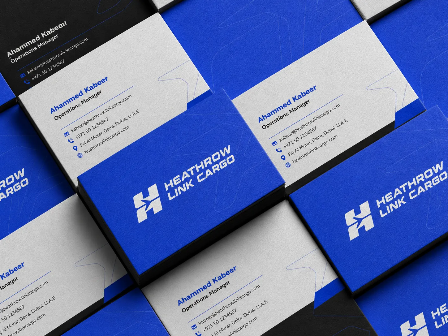 Stationery system — italic blue typography, contact iconography, dual blue / black cardstock.